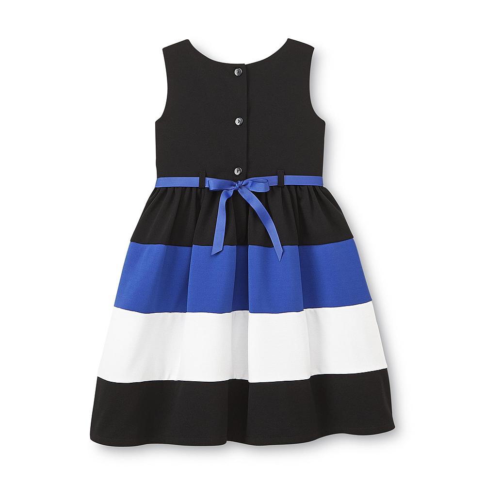 Vestido a rayas con flor en cintura